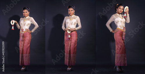 Full length body of 20s Asian Woman wear Thai Gold white traditional costume or Golden red wedding