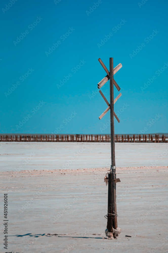wooden cross on the lake
