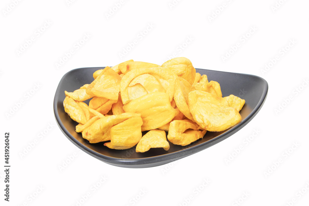 Dried jackfruit. Close up of a pile of dried jackfruit on a black plate for a snack chips. isolated on white background. Food preservation concept popular in Thailand. Suitable for party. Dried jackfruit. Close up of a pile of dried jackfruit on a black plate for a snack chips. isolated on white background. Food preservation concept popular in Thailand. Suitable for party.