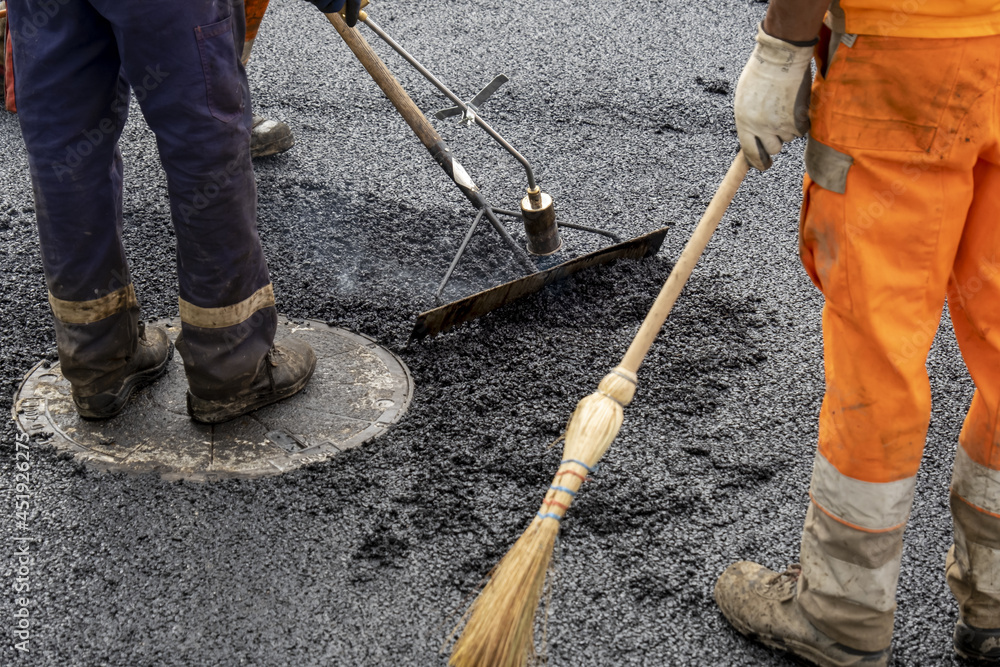 Paving a road with porous asphalt for traffic noise reduction in Geneva, switzerland. Paving a road with porous asphalt for traffic noise reduction in Geneva, switzerland.