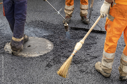 Paving a road with porous asphalt for traffic noise reduction in Geneva, switzerland. 