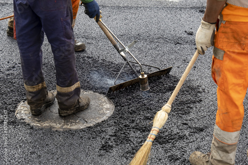 Paving a road with porous asphalt for traffic noise reduction in Geneva, switzerland. 