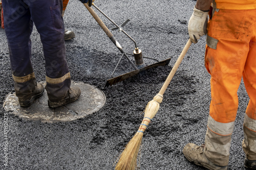 Paving a road with porous asphalt for traffic noise reduction in Geneva, switzerland. 