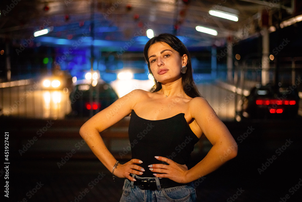 Night portrait of a charismatic girl