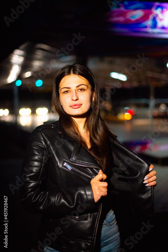 Night portrait of a charismatic girl