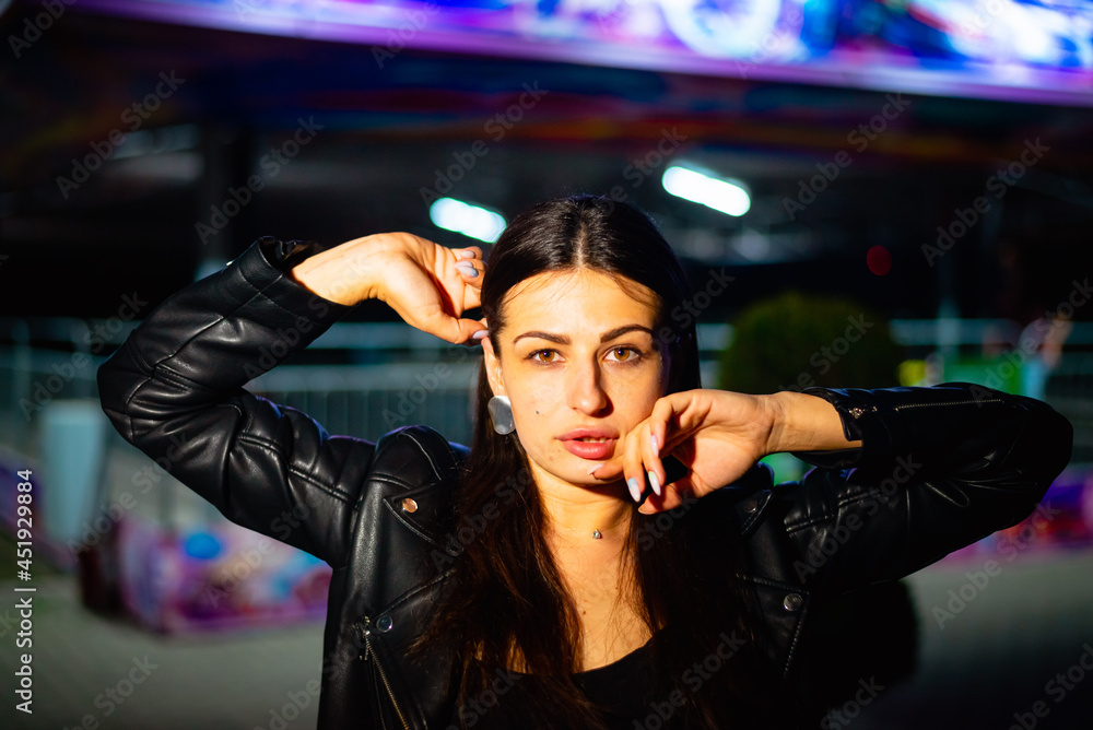 Night portrait of a charismatic girl