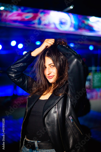 Night portrait of a charismatic girl