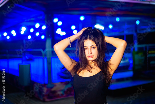 Night portrait of a charismatic girl