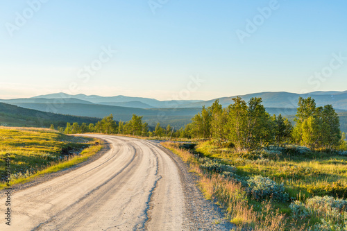 Dirt road in the highlands with a beautiful scenics landscape