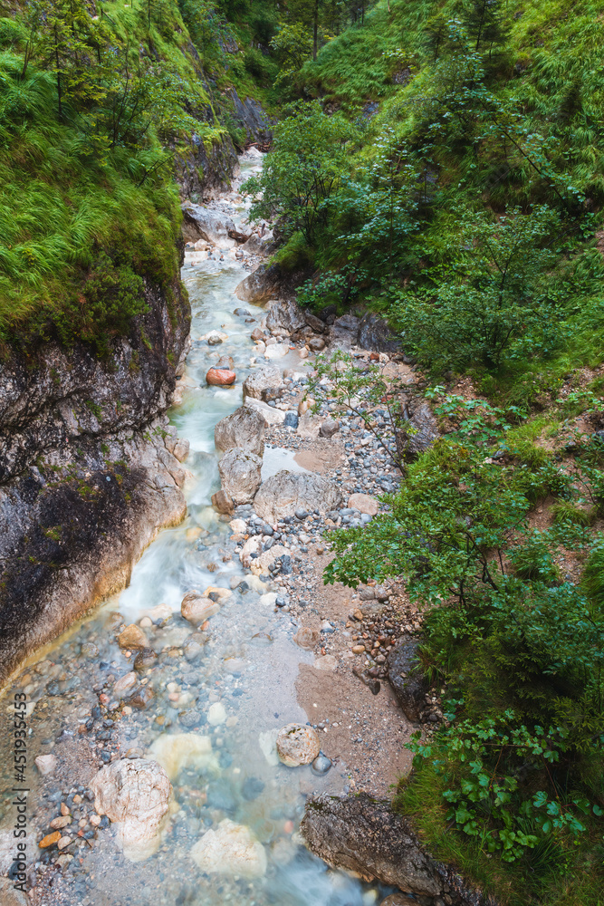 Klausbach river with small waterfall in Austrian Alps, valley near attersee. Long exposure Klausbach river with small waterfall in Austrian Alps, valley near attersee. Long exposure