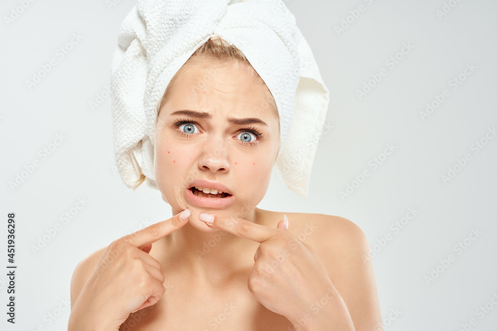 woman with bare shoulders with a magnifying glass in her hands black dots on her face woman with bare shoulders with a magnifying glass in her hands black dots on her face