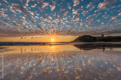Beach sunrise reflections