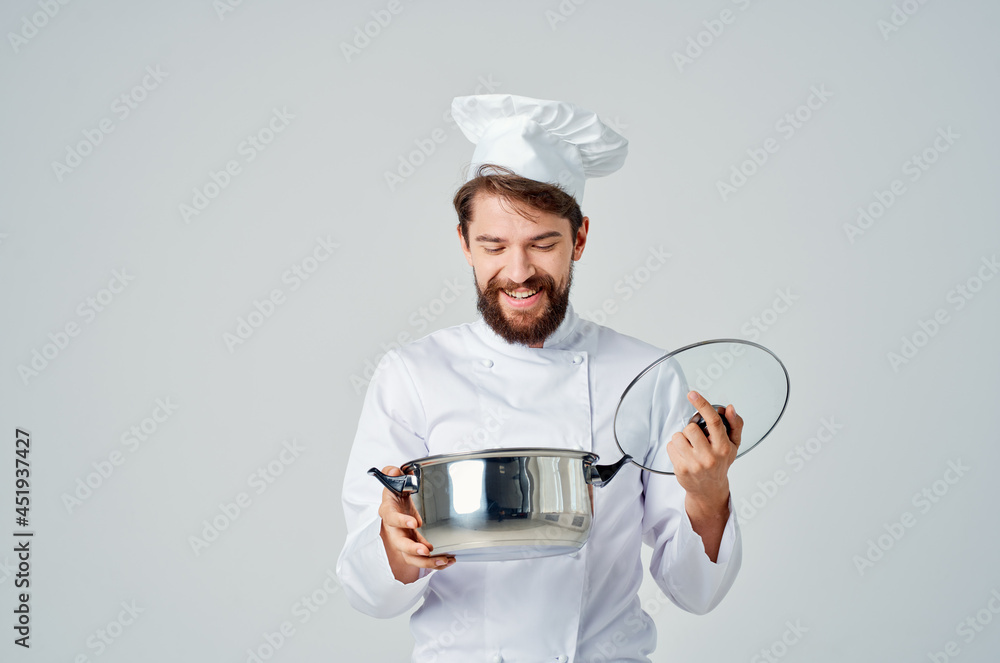 male chef with a saucepan in his hands cooking food kitchen lifestyle male chef with a saucepan in his hands cooking food kitchen lifestyle