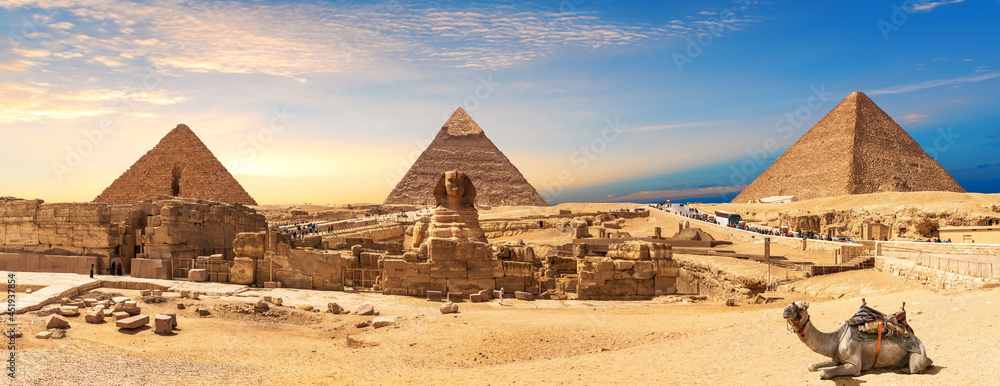 Giza Pyramids and Sphinx panorama with a camel lying by, Cairo, Egypt