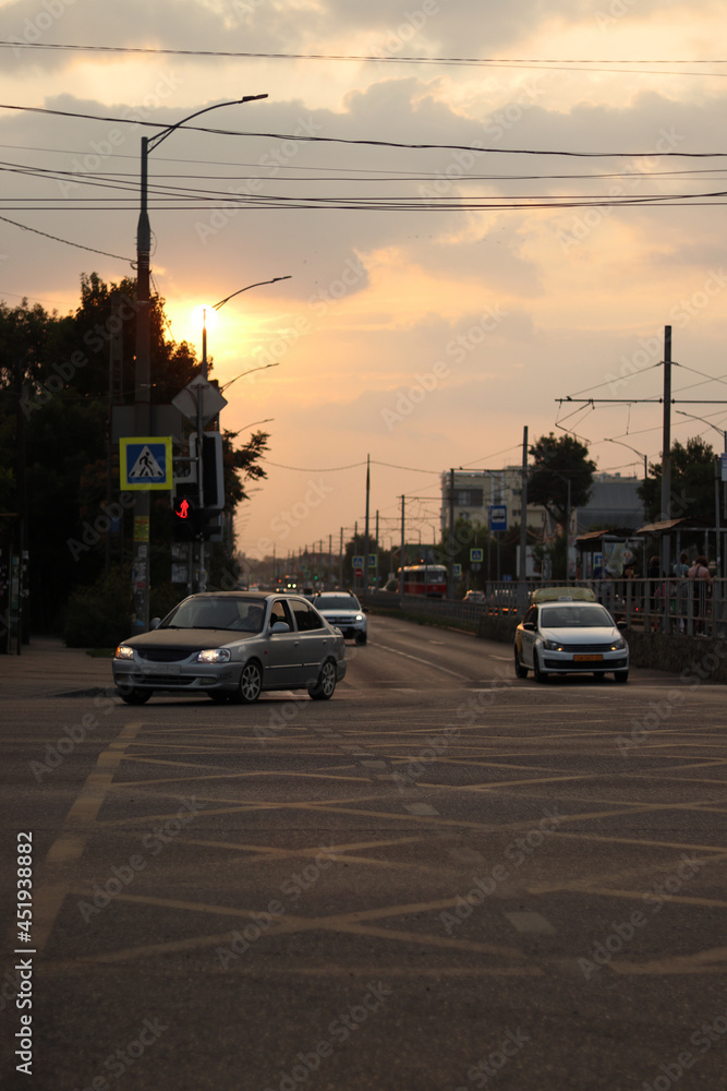 cityscape road with cars at sunset in the evening
