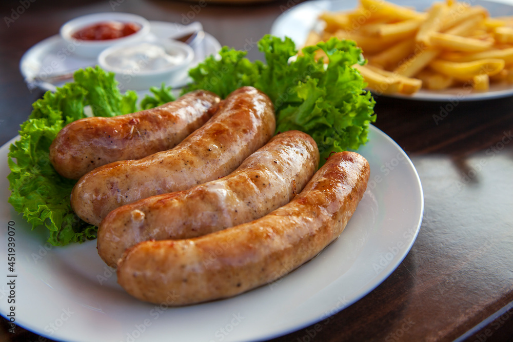 The Munich sausages with fries and sauce