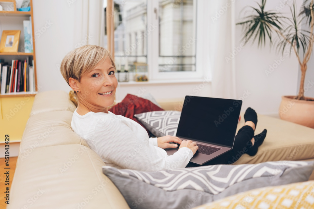 Woman telecommuting or working from home Woman telecommuting or working from home