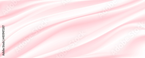 Cream pink satin or silk fabric as background.Light pink silk or satin luxury fabric texture can use as abstract background.