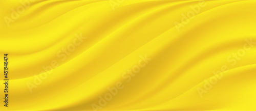 The luxury of yellow fabric texture background.Closeup of rippled yellow silk fabric.Abstract cloth or liquid wave vector background.Cloth soft wave. Creases of satin, silk, and cotton.