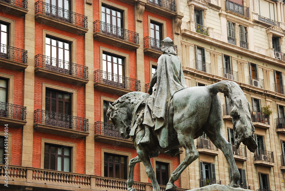 Barcelona Street view: A Statue of a rider facing historical buildings