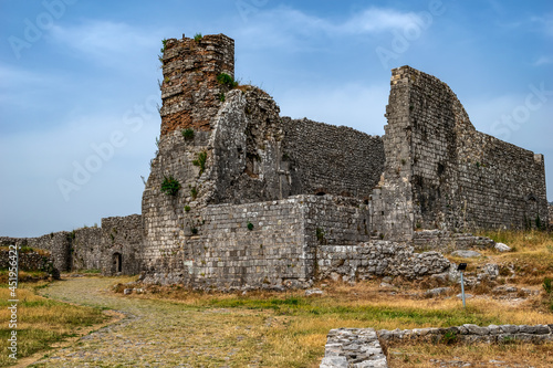 Ruins of a medieval building in Shkoder Castle (Albania). Dilapidated ancient stone walls against the blue sky