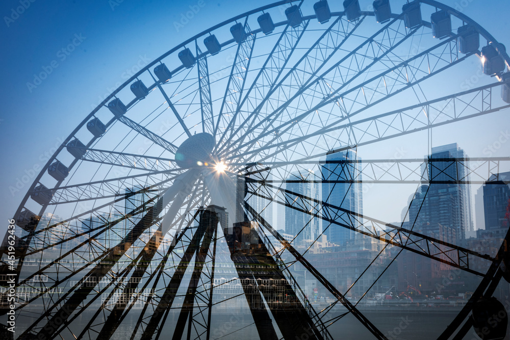 double exposure of a ferris wheel and the Seattle skyline