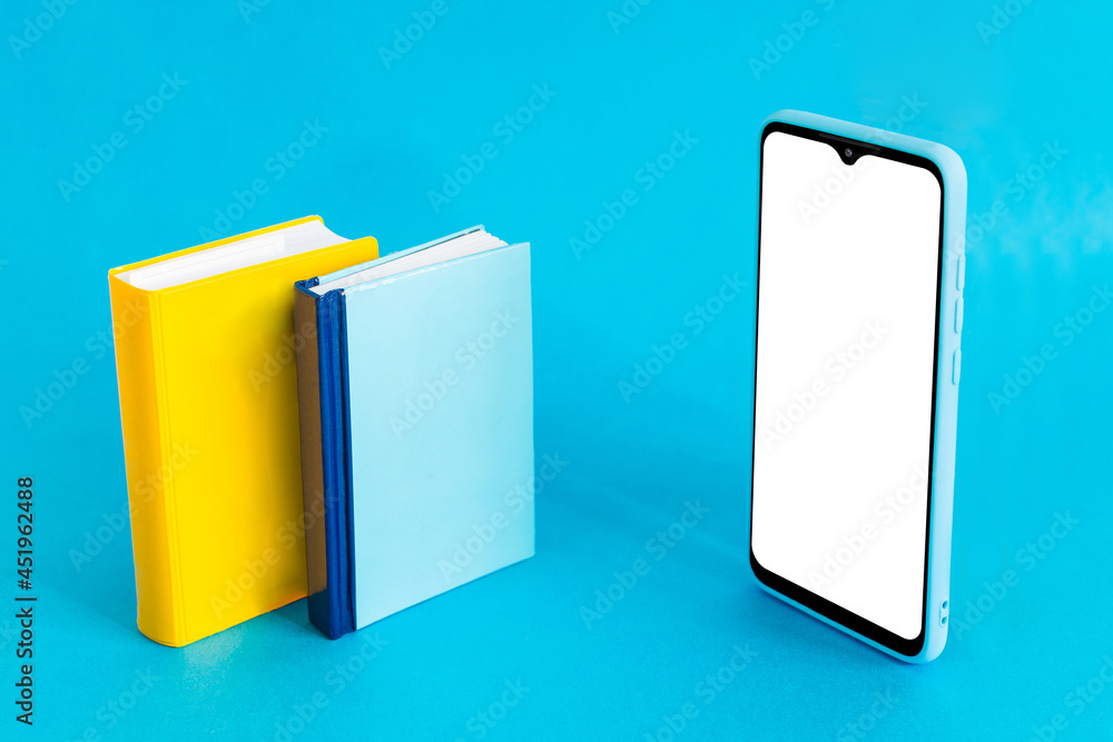 Isometric view of mobile phone and two books on light blue background. Distance education. Isometric view of mobile phone and two books on light blue background. Distance education.