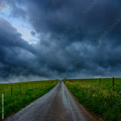 Spring storm clouds over Hampshire hills and lanes, South Downs National Park, UK