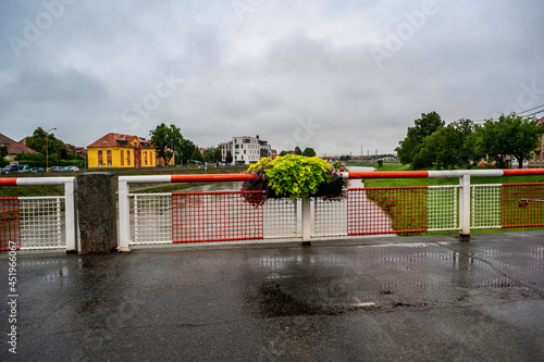 Bridge over river Morava in Uherske Hradiste in rainy summer day. photo