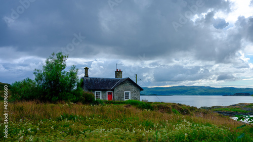 Stormy skies over Sound of Jura, Corryvreckan and island from Craignish Point, Scotland photo