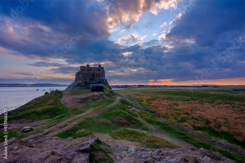 Summer evening and sunset views of Lindisfarne Castle on Holy Island, Northumberland, UK