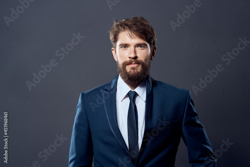 The man in a suit executive office dark background