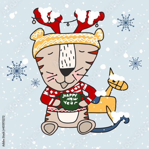 A cheerful winter tiger in a New Year's hat with deer horns drinks hot chocolate and plays with a wooden rocking horse.Hand drawn cute print for posters, cards, t-shirts.