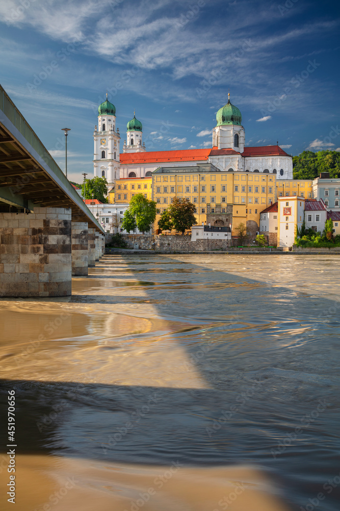 Passau, Germany. Cityscape image of Passau with the St. Stephan's Cathedral and Mary's Bridge or Mariensbrucke over Inn River at sunny summer day.