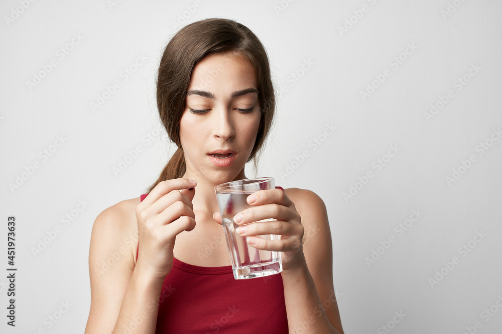 woman in red t shirt medicine health problems light background woman in red t shirt medicine health problems light background