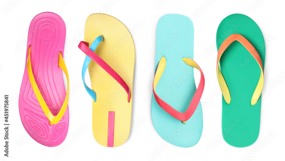 Set with different colorful flip flops on white background, top view Set with different colorful flip flops on white background, top view