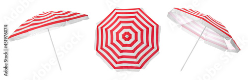 Set with striped beach umbrellas on white background. Banner design photo