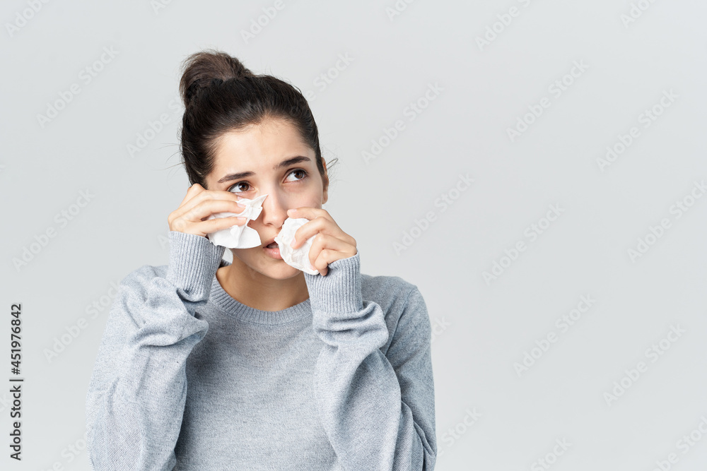 sick woman on wipes her nose health problems light background sick woman on wipes her nose health problems light background