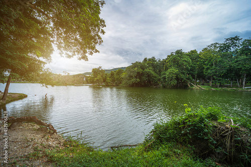 landscape lake views at Ang Kaew Chiang Mai University in nature forest Mountain views spring cloudy sky background with white cloud.