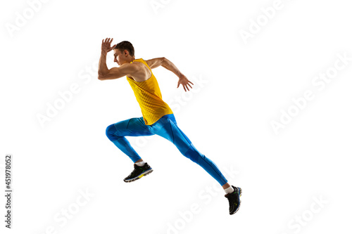 Profile view of Caucasian professional male athlete, runner training isolated on white studio background. Concept of action, motion, youth, healthy lifestyle.