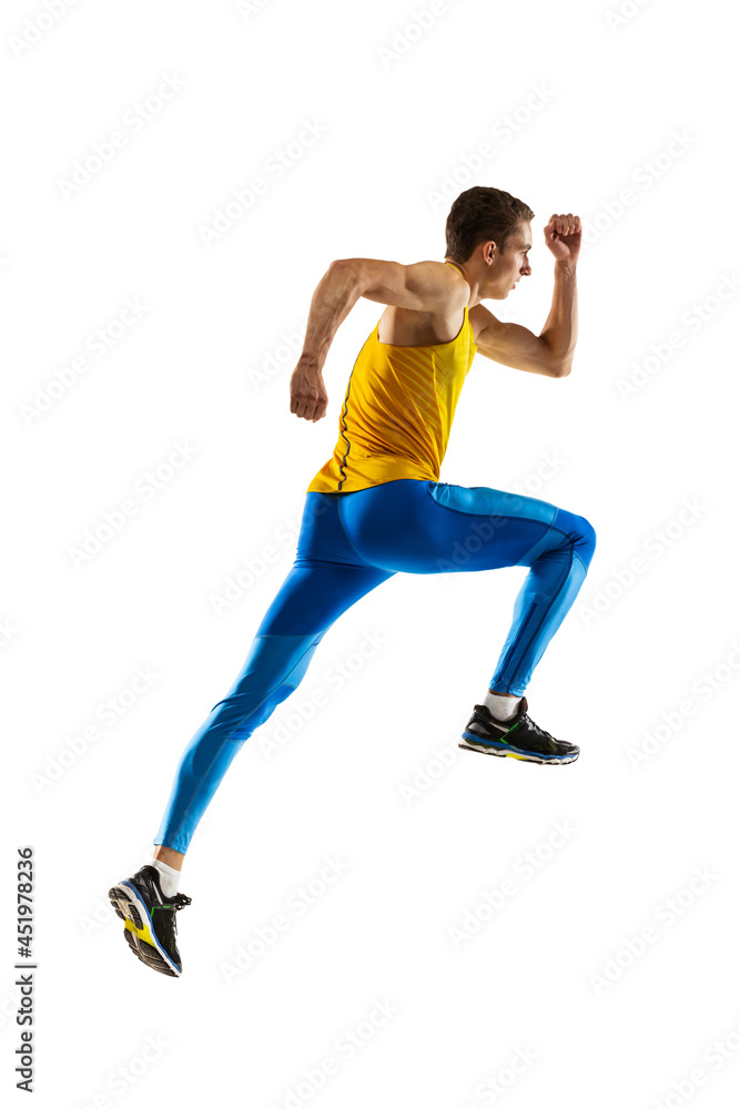 Back view of Caucasian professional male athlete, runner training isolated on white studio background. Muscular, sportive man. Concept of action, motion, youth, healthy lifestyle.