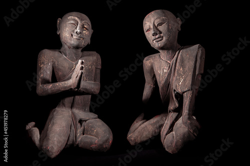 Buddhist monks in peaceful meditation. Traditional vintage Thai buddhism statues