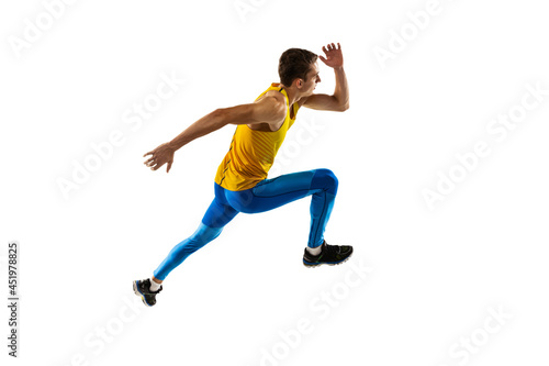 Caucasian professional male athlete, runner training isolated on white studio background. Muscular, sportive man. Concept of action, motion, youth, healthy lifestyle.