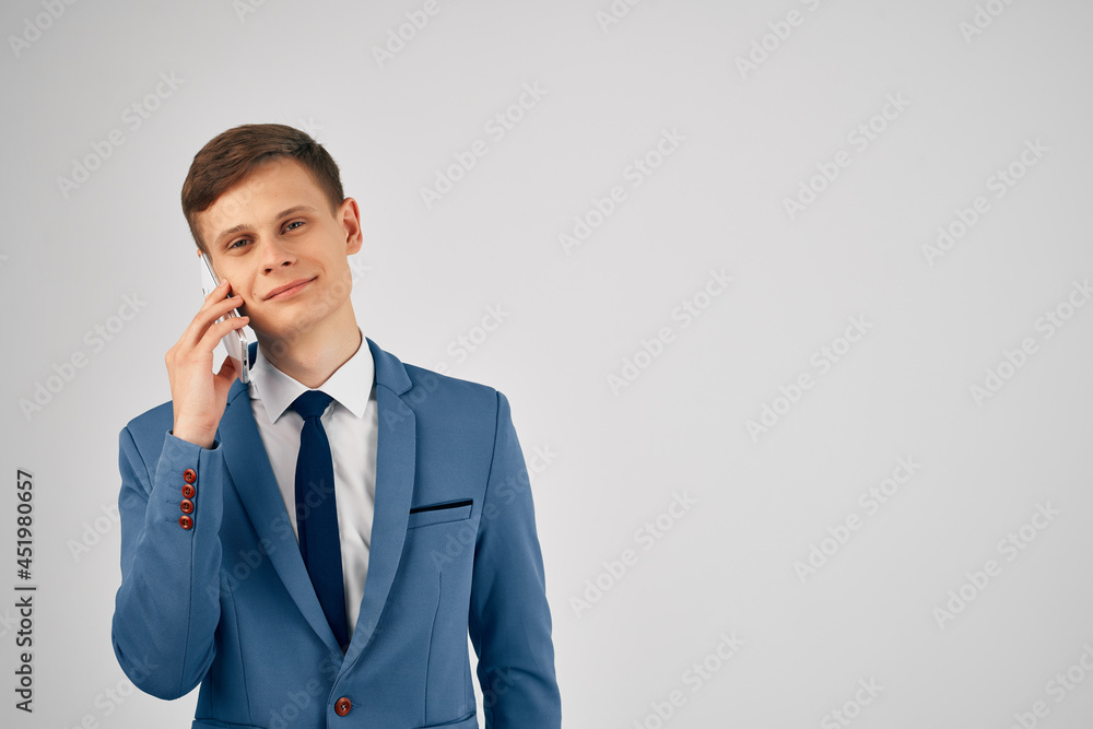 business man in a suit talking on the phone self-confidence business man in a suit talking on the phone self-confidence