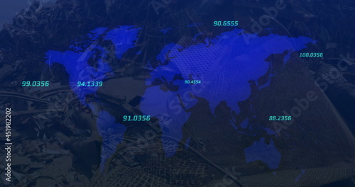 Numbers moving over world map against urban industrial site