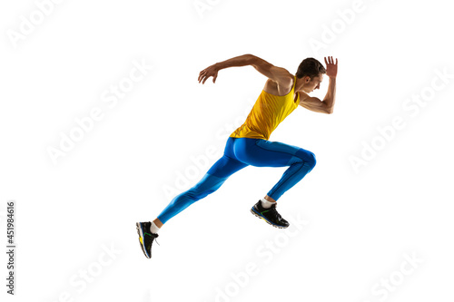 Caucasian professional male athlete  runner training isolated on white studio background. Muscular  sportive man. Concept of action  motion  youth  healthy lifestyle.