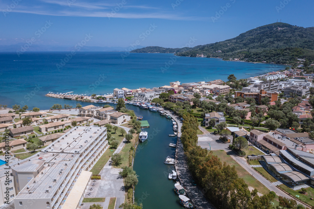 Messonghi Beach holiday resort over canal separating Moraitika and Messonghi villages on a Corfu Island, Greece