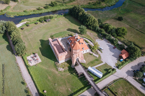 High angle view of medieval castle and Liwiec river in Liw, small village in Wegro County, Masovia region of Poland photo