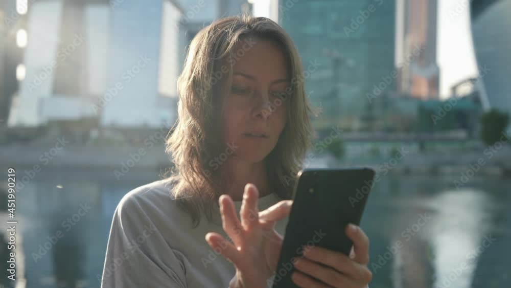 modern woman with smartphone in city center, using social networking and apps in gadget modern woman with smartphone in city center, using social networking and apps in gadget
