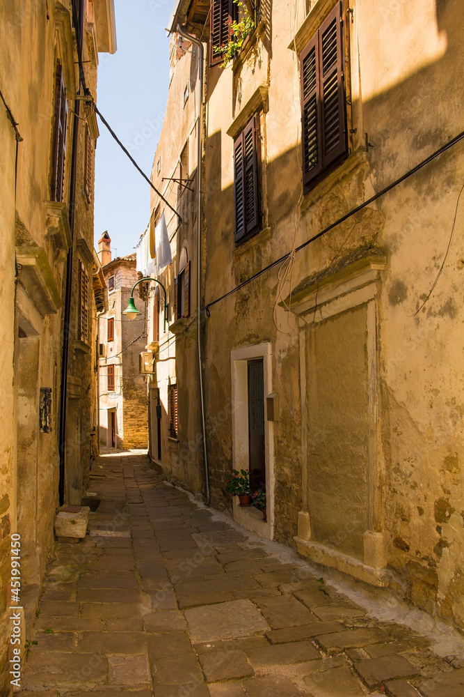 A residential road in the historic medieval hill village of Buje in Istria, Croatia
